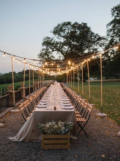 an al fresco dinner setting with a ceiling of fairy lights over a long table in a bohemian style decor Long Table Ideas, Long Dinning Table, Extra Long Table, White And Gold Dress, Corporate Gala, Beneath The Stars, 30th Birthday Bash, Bohemian Chic Decor, Al Fresco Dinner