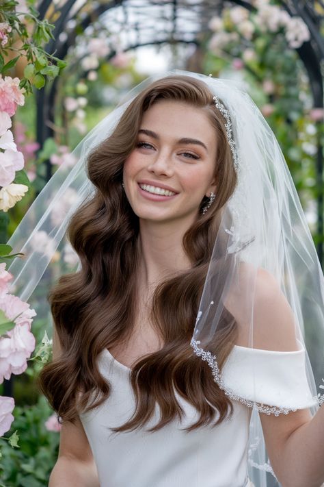 Discover the romance of elegant wedding hairstyles that perfectly complement your veil. This classic bridal updo features intricate twists and delicate braids, creating an exquisite backdrop for soft, flowing fabric. With beautiful embellishments like floral accents, your bridal style will be breathtakingly enchanting. Embrace the timeless charm of this look, ensuring you shine on your special day. #weddinghairstyles #bridalupdo #weddingveil Bridal Hairstyles With Headband And Veil, Bridal Waves With Veil, Romantic Wedding Hair With Veil, Half Up Half Down Wedding Hair With Mantilla Veil, Natural Curls Wedding Hair Veil, Bridal Soft Waves With Veil, Wedding Hair Down With Veil Loose Curls, Wedding Hair Styles With Veil, Soft Romantic Curls Wedding