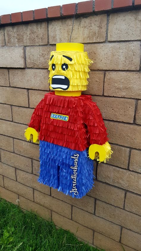 Lego Birthday Pinata, Lego Piñata Ideas, Lego Pinata Diy, Lego Party Ideas Decoration Diy, Lego Themed Birthday Party Decoration, Lego Masks, Lego Centerpiece Ideas, Lego Party Ideas Decoration, Lego Birthday Party Games