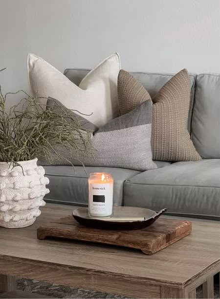 Shop "pillows for gray couch" on LTK Grey Couches Pillow Ideas, Grey Pillows Couch, Gray Couch Neutral Pillows, Grey Couch Tan Pillows, Light Grey Couch Styling Modern, Neutral Pillows For Gray Couch, Couch Pillow Arrangement Sectional Gray, Grey Couch Neutral Pillows, Grey Couch Cream Pillows