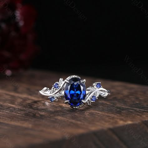 Oval cut blue sapphire engagement ring women silver gold ring unique art deco leaf ring nature branch ring September birthstone promise gift -----Ring Information----- Metal Type: 925 sterling silver, 10K/14K/18K Solid Gold, Platinum Center stone: Lab blue sapphire Stone size: 6x8mm oval shaped Side stone: Blue sapphire (contact me if you need other stones) ✦ Please feel free to contact me if you have any questions or you are interested in custom order. ✦Our Service: Custom Order All Sizes Engra Silver Sapphire Engagement Rings, Engagement Rings Silver Sapphire, Wedding Rings With Sapphires, Silver Sapphire Engagement Ring, Saphire Engament Ring Set Silver, Sapphire Engagement Ring Silver, Blue Stone Engagement Ring, Sapphire Rings Engagement, Engagement Ring Blue Stone