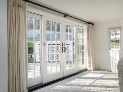 Large windows are a popular feature these days. They offer more sunlight and make the house airier. In fact, because of their advantages, all modern h... | Use One Set of Curtains for the Entire Door Window Area #LargeWindows #Curtains #curtainsforlargewindows #largewindowcurtains #windows #decoratedlife Sliding French Doors Patio, Patio Door Coverings, French Doors Bedroom, Sliding Door Window Treatments, Sliding Door Curtains, Oval Glass Front Door, Sliding French Doors, Door Window Treatments, French Door Curtains