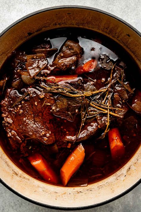 You don't need an expensive cut of beef to make a restaurant-worthy meal – this Red Wine Braised Beef recipe is proof! Slowly simmer beef chuck roast with red wine, vegetables, & herbs until it transforms into a succulent centerpiece complete with a built-in red wine sauce. Serve with creamy mashed potatoes for the best cozy dinner! (Slow cooker/Crockpot & Instant Pot directions provided.) #redwinebraisedbeef #redwinebeefroast #braisedbeef ##braisedbeefroast #beefroast #beefrecipes #dinnerideas Red Wine Beef Roast, Roast With Red Wine, Red Wine Braised Beef, Wine Braised Beef, Beef Braised, Braised Beef Recipes, Chuck Roast Recipes, Best Pot Roast, Beef Pot Roast