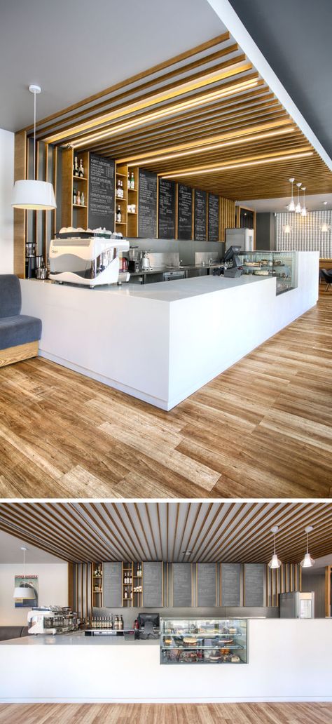 This cafe service counter mixes white counters with glass, wood detailing and chalkboards. Hidden lighting runs overhead along the the wooden details. Cafe Counter, Hidden Lighting, Sandwich Bar, Cozy Coffee Shop, Kiosk Design, Coffee Shops Interior, Counter Design, Coffee Shop Design, Cafe Interior Design