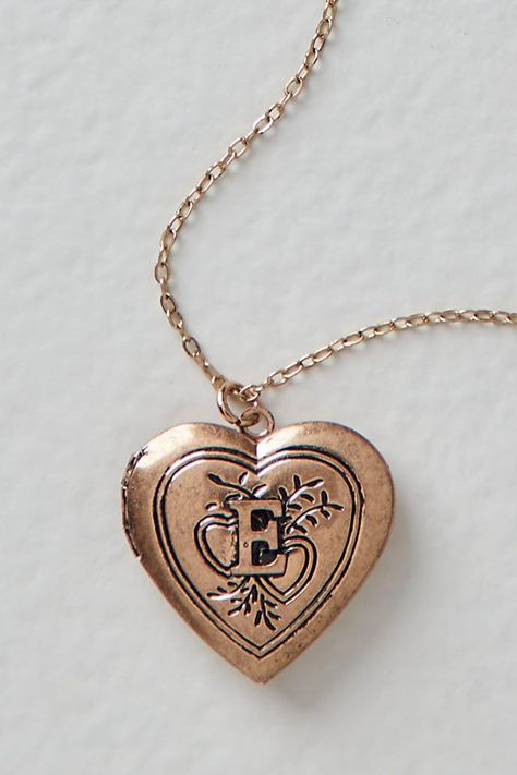 A super sweet gift or an accessory unique to you, this darling monogram necklace features a heart locket pendant with an initial engraving. **Features:** Dainty chain, heart locket pendant, hinge opening mechanism, monogram initial engraving, clasp closure **Why We | Monogram Necklace by Free People in Gold Free People Necklace, Ella Enchanted, Chain Heart, Heart Locket Necklace, Vintage Lockets, Gold Locket, Dainty Chain, Monogram Necklace, Cheap Gifts