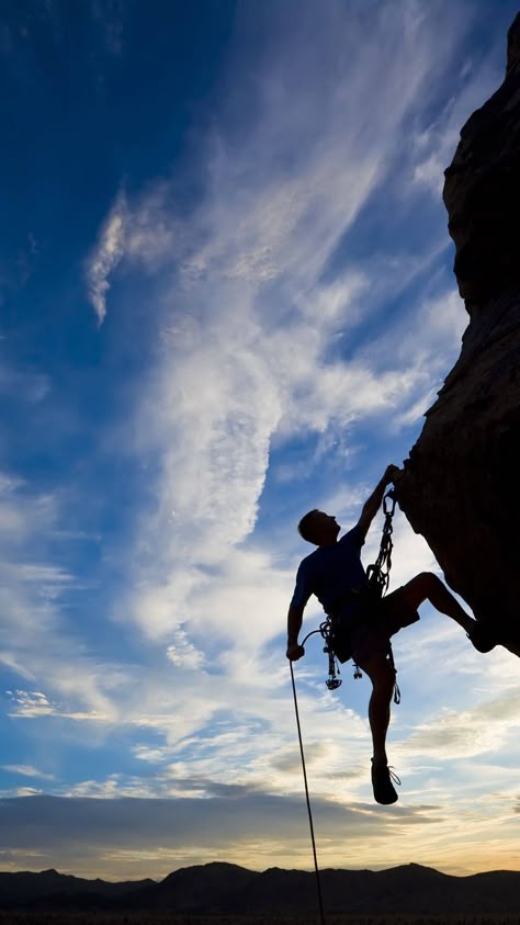 Download Silhouetted Man Climbing A Rock Wallpaper | Wallpapers.com Rock Climbing Photography, Climbing Photography, Climbing Art, Iphone Wallpaper Video, Wallpaper Video, Mountain Climbing, Apple Wallpaper, Homescreen Wallpaper, Rock Climbing