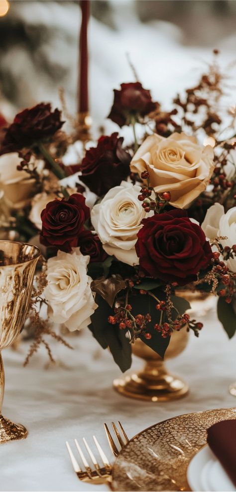 Elegant wedding table setup featuring burgundy and gold decor, perfect for a winter celebration with urban chic and vintage vibes. Wedding Colors Burgundy And Gold, Burgundy Gold Color Palette, Maroon And Gold Wedding Decor, Dark Academia Wedding Colors, Burgundy And Gold Color Palette, Black Burgundy And Gold Wedding Theme, Maroon And Champagne Wedding, Cabernet Wedding Colors, Burgundy Theme Wedding