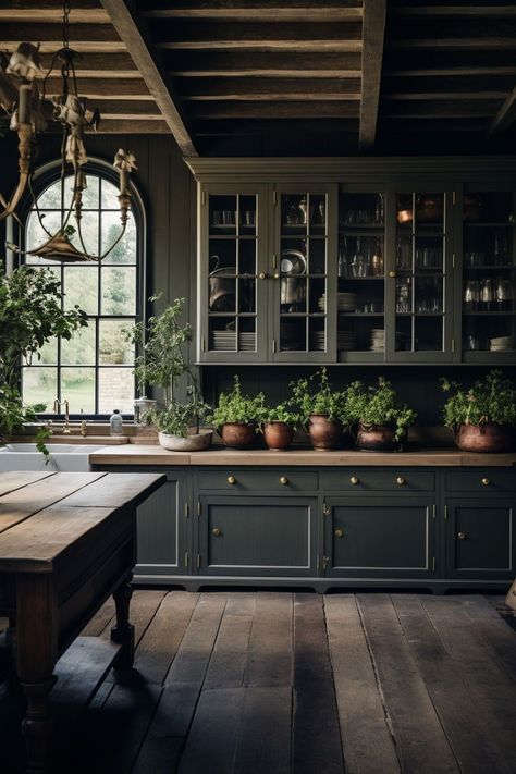 Discover the allure of moody farmhouse kitchen ideas that blend the warmth of traditional rustic design with a hint of contemporary drama. Embrace deep, rich color palettes, weathered wood accents, and vintage-inspired fixtures to infuse your kitchen with an inviting ambiance. Let the interplay of dark hues and natural textures transport you to a space that exudes timeless charm and modern elegance. Gothic Kitchen Ideas, Moody Farmhouse, Moody Kitchen, Old World Kitchens, Gothic Kitchen, Farmhouse Kitchen Ideas, Green Cabinets, Farmhouse Style Kitchen, Design Del Prodotto