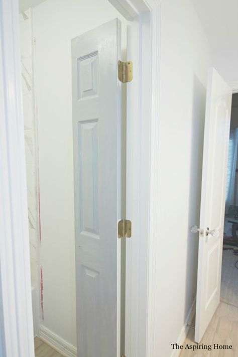 DIY Petite Double Doors From Bifold Doors | The Aspiring Home Sliding Double Doors Interior Small Spaces, Bifold Accordion Doors, Bifold Door For Bathroom, Paint Bifold Doors, Bathroom Closet Door Ideas Small Spaces, Vertical Split Door, Tiny Bathroom Door Ideas, Diy Bathroom Door Ideas, Bifold Door Bathroom