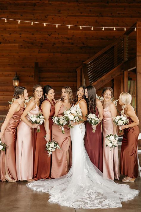 Bride in Lace Wedding Gown with Mismatched Bridesmaids in Shades of Red and Pink | White Floral Wedding Bouquets Burgundy And Peach Bridesmaid Dresses, Mismatch Red Bridesmaid Dresses, Bridesmaid Dresses Red Shades, Bridal Colour Combination, Pink Shades Bridesmaids, Mismatched Bridesmaid Dresses Burgundy, Fall Pinks Wedding, Autumn Bridesmaids Dresses, Cream And Maroon Wedding