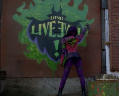 mal spray painting her mothers logo on the isle of the lost from the movie descendants #descendents #descendents2 #descendents3 #disney #disneyvillians #disneyvilliankids #theisleofthelost #pinthis #mal #evie #villiankids #carlos #kingben #jay #audrey #sofiacarson #thomasdoherty #uma #chinaannemcclain #sarahjeffry #sarahjeffries #vkahestic #ahestic #villankidahestic #descendentsahestic #malahestic #evieahestic #carlosahestic #jayahestic The Isle Of The Lost, Mal Descendants, Descendants Party, Mal And Evie, Booboo Stewart, Rotten To The Core, Isle Of The Lost, China Anne Mcclain, Bad Songs