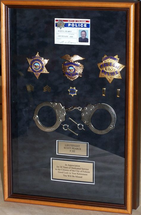 This police shadow box was a retirement gift and includes the badge, handcuffs and plaques on a suede mat with a formal frame to compliment. #custom #framing #customframing #shadowbox #police #retirement #gift Badge Display Ideas, Police Retirement Gift Ideas, Retirement Shadow Box Ideas, Police Shadow Box Ideas, Police Officer Shadow Box Ideas, Police Retirement Shadow Box Ideas, Police Academy Graduation Shadow Box, Law Enforcement Shadow Box Ideas, Police Challenge Coin Display