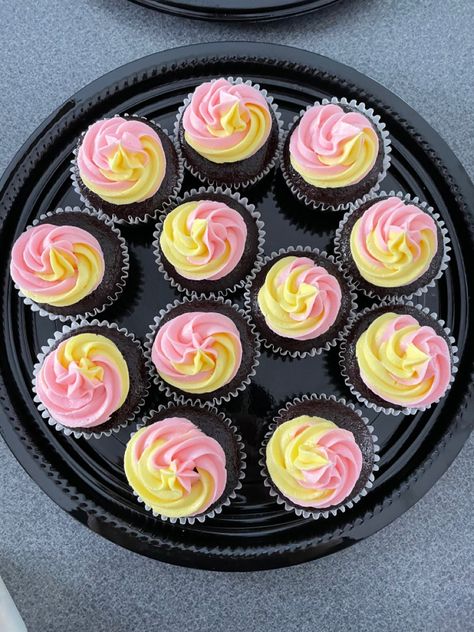 Light pink and yellow swirled cupcakes using Wilton 1M tip. Perfect for a lemonade themed party! Light Yellow Cupcakes, Pastel Pink And Yellow Party Decor, Pink And Yellow Tea Party, Pink Yellow Party Decor, Pink And Yellow Cakes, Pink And Yellow Birthday Party Ideas, Pink And Yellow Party Ideas, Pink And Yellow Decor Party Ideas, Pink And Yellow Picnic