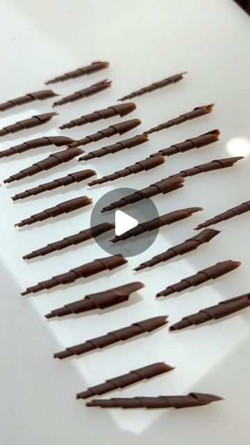 Christian Dewabrata on Instagram: "°Here’s another hands-free chocolate garnish tutorial. Making these kind of hands-free decorations is pretty much hard to make similar looking ones .but as long as we keep the same length and size it will look pretty similar one to another. What we need is just a paring knife, set it to around 20-30° from the surface and push with the same length and pressure. And do it on a semi-set tempered chocolate. Please try!°
•
•
•
•
•
•
•
•
#ChristianDs #CDS #cheftalk #chocolateshowpiece #showpiece #chocolategarnish #flower#chocolatefan #valrhonafrance #chocolatearrangement #pastry #coklat #chocolatefans 
#indonesiapastry #chocolate #garnish #indonesiapastryalliance #pastrychef #pastryart" Tempered Chocolate Decorations, Chocolate Garnish Ideas, Tempered Chocolate, Chocolate Showpiece, Chocolate Work, Chocolate Garnishes, Wedding Welcome Board, Dessert Presentation, Pastry Art