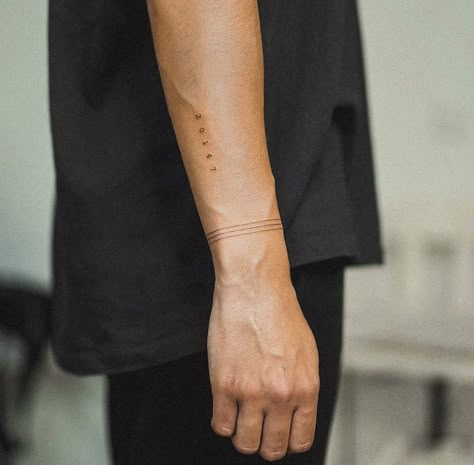 Minimal Wrist Tattoo Men, Tattoo Date Of Birth Numbers, Mens Tattoo Minimalist, Wrap Around Band Tattoo, Minimal Arm Band Tattoo, Low Key Tattoos, Stripes Tattoo Men, Solid Line Tattoo Arm, Wrap Around Line Tattoo