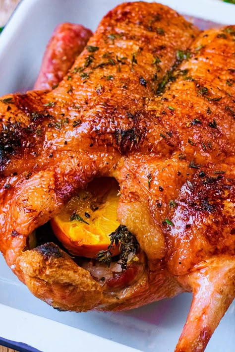 If you are looking for something a little bit different to serve for Christmas dinner or Thanksgiving, then why not try this Honey Roast Duck? Crispy slow roasted duck with a little sweetness from the honey and orange and a hint of thyme. The festive season doesn't have to be all about turkey, and your guests might appreciate the change. A whole duck, oven roasted to perfection - it's easy and healthy. Honey Roasted Duck, Slow Cooked Duck Recipes, How To Roast A Whole Duck, Duck In Oven Recipe, Best Oven Roasted Turkey Recipe, Dutch Oven Duck, Roast Goose Christmas, Duck La Orange Recipe, Thanksgiving Duck Recipes