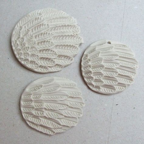 https://flic.kr/p/9vVagB | feathers | playing with feather designs and textures, I'll probably leave one white, glaze one and use underglaze colours on another....maybe... Feather Texture, Ceramic Texture, Clay Texture, Surface Decoration, Ceramic Techniques, Polymer Crafts, Feather Design, White Glaze, Ceramic Pottery