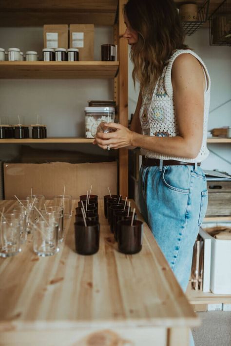 Woman making candles from her home studio, The Smallest Light, Wales Candle Makers Studio, At Home Candle Studio, Candle Studio Ideas At Home, Candle Making Room Setup, Candle Workspace, Candle Studio Organization, Candle Making Business Ideas, Small Business Candles, Home Candle Studio