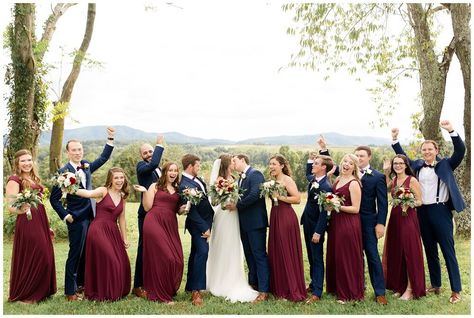 Fun bridal party photos with wine red chiffon bridesmaid dresses, fall florals, and navy groomsmen suits Fall Wedding Burgundy Bridesmaid Dresses, Wine Red Wedding Groomsmen, Wine Red Bridal Party, Navy Suit Bridesmaid Dresses, Maroon Bridal Party, Fall Wedding Party Attire, Navy And Maroon Wedding, Burgandy Bridesmaids Dress, Wine Bridesmaid Dress