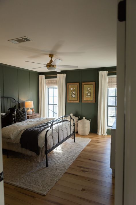 Dark green master bedroom with board and batten. House Design Moody, Light Bedroom Dark Accents, Vintage Area Rug Bedroom, Airy Master Bed, Edgy Green Bedroom, Dark Green Walls Bedroom Decor, Chair Rail Bedroom Two Tones, Unique Home Styles, Different Board And Batten Styles