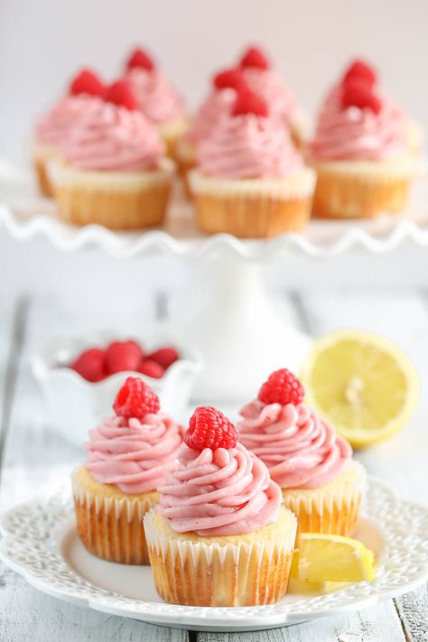 Light and moist lemon cupcakes topped with an easy raspberry buttercream frosting. These Lemon Cupcakes with Raspberry Buttercream Frosting are absolutely delicious! Moist Lemon Cupcakes, Raspberry Lemonade Cake, Hawaii Cupcakes, Raspberry Lemonade Punch, Raspberry Lemonade Cupcakes, Raspberry Lemonade Recipe, Lemon Raspberry Cupcakes, Luau Cupcakes, Up Cupcakes