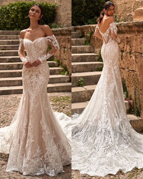 Embrace a blend of vintage lace and modern illusion with Val Stefani's Damita wedding dress. The off-shoulder cut and long sleeves create a timeless silhouette, perfect for a classic and elegant bride. Experience the romance and grace of this stunning dress with its lace detailing and sheer illusion back. #fittedweddingdress #bridalfashion #weddingdresswithsleeves Wedding Dresses Long Sleeve Mermaid, Intricate Lace Wedding Dress, Goddess Wedding Gown, Lace Arm Wedding Dress, Modern Elegant Wedding Dress Lace, Tattoos Wedding Dress, Form Fitting Lace Wedding Dress, Long Sleeve Trumpet Wedding Dress, Vintage Mermaid Wedding Dress