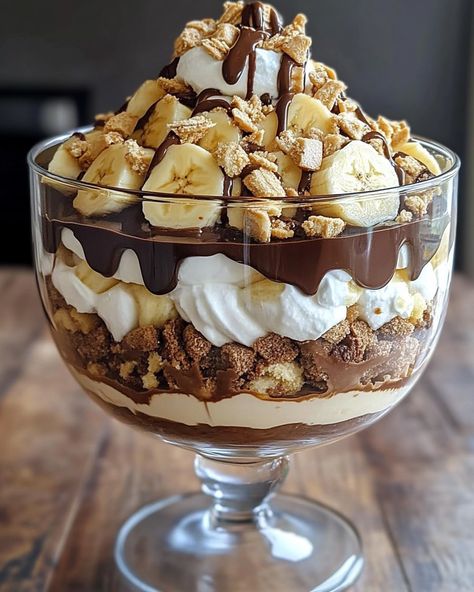 🍫 Chocolate Peanut Butter Banana Cream Trifle 🍌🥜 Layers of chocolate, peanut butter, and bananas come together in this creamy, decadent trifle! Ingredients: For the Chocolate Layer: 1 box (3.9 oz) instant chocolate pudding mix 2 cups cold milk For the Peanut Butter Layer: 1 cup creamy peanut butter 8 oz cream cheese, softened 1 cup powdered sugar 1 teaspoon vanilla extract 1 cup whipped cream or whipped topping For the Banana Layer: 3-4 ripe bananas, sliced For the Whipped Cream: 1 cup... Banana Cream Trifle, Peanut Butter Banana Recipes, Banana Trifle, Trifle Dessert Recipes, Buying In Bulk, Trifle Desserts, Ripe Bananas, Peanut Butter Recipes, Banana Cream