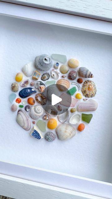 Nicola Fewings | Luxury Shell & Sea Glass Art📍Cornwall on Instagram: "Here it is!  A lovely previous customer of mine messaged to ask if I’d like to donate anything to the fundraiser she was doing for an Alzheimer’s charity. She’s running the London Marathon to raise money and I’m in awe of anyone who can do that, so I said yes 🩷  Here’s the artwork that will be sent off to its new owner soon.  #circularart #circleart #shellart #seashells🐚 #seashellcollection #shellcollection #marineplastic #cornishseaglass #blueseaglass #greenseaglass #limpets #mussels #periwinkles #cornishbeaches #seashelladdict #seashellart #oceanart #coastalartwork #coastalhomedecor #coastalinterior #artforinteriordesign #artforinterior #undertheseatheme #seatheme #lilyandsea" Shell Frame Diy, Alzheimers Art Projects, Seashell Projects Artwork, Sea Glass And Shell Art, How To Display Shells, Sea Shell Crafts Seashell Art, Shell Pictures, Shells Craft, Seashell Artwork