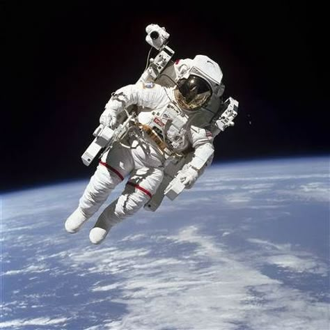 Image: This Feb. 7, 1984 photo made available by NASA shows astronaut Bruce McCandless II, participating in a spacewalk a few meters away from the cabin of the Earth-orbiting space shuttle Challenger, using a nitrogen-propelled Manned Maneuvering Unit. Background Stars, Space Shuttle Challenger, Space Walk, Astronaut In Space, Space Suits, Nasa Missions, Sky Stars, Nasa Astronauts, Space Stuff