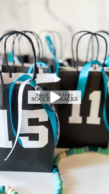 Sierra Miller | Content Creator on Instagram: "I’m on snack mom duty this weekend so you know I had to go all out! ⚽️🙈   I found these bags @hobbylobby and put each team member’s jersey # on the front. I cut the numbers with my @cricut but you could also use stickers for this part if you don’t have a cricut. To bring it all together, I added some coordinating ribbon, which really completed the look! Then, I filled it with some goodies to enjoy after the game. 😍 Being a mom is so much fun..🥹 . . . . . #soccerlife #soccermom #snackmom #soccersnacks #soccersnackideas #kidssoccer #giftideas #soccerparty #soccerpartyideas" Last Soccer Game Treats, Team Mom Soccer, Football Mom Snack Ideas, Sports Snack Ideas Team Mom, Football Team Treats Goodie Bags, Soccer Team Goodie Bag Ideas, Soccer Gift Bags For Team, Soccer Goody Bags Ideas, Football Goodie Bags For Players