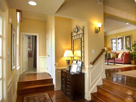 This foyer is a space all its own. Delineated by steps up to the great room or to the front closet, the entry has a charming sunken feeling that allows guest to look up to the living areas. Fir Floors, Foyer Ideas Entryway, Front Closet, Vintage Setting, Farmhouse Entry, Pocket Garden, Hotel Lobby Design, Foyer Ideas, Entry Ideas