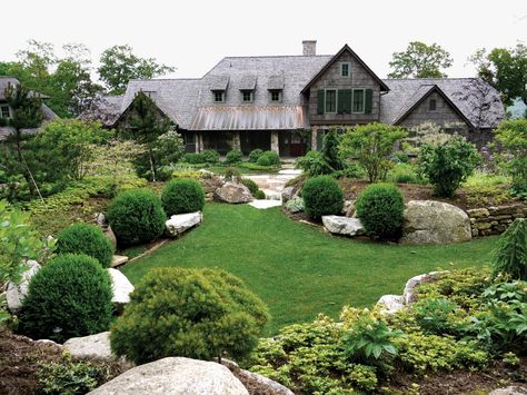 This rustic lodge features a beautiful landscape accented with large rocks. Landscaping Shrubs, Evergreen Landscape, Evergreen Garden, Rock Garden Design, Rock Landscaping, Home Landscape, Large Backyard, Backyard Landscape, Front Lawn