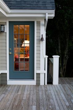 painted back door, captains bell; RFD Architects | Fair Winds Seaside Renovation Back Door Ideas, Knoxville Gray, Painted Exterior Doors, Interior Door Colors, Color Spotlight, Exterior Door Colors, Moody Green, Casa Vintage, Door Steps