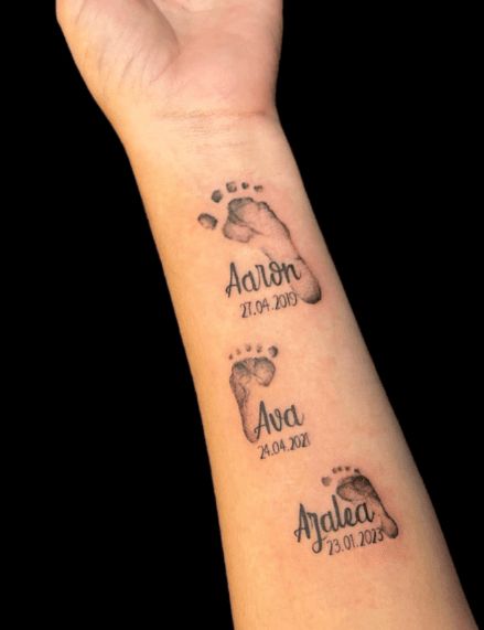 80+ Baby Footprint Tattoo Ideas To Celebrate Your Bundle Of Joy Footprint With Name Tattoo, Kids Footprint Tattoo, Child Footprint Tattoo, Baby Handprint Tattoo Ideas, Footprint Tattoo Ideas Mom, Baby Feet Tattoos For Moms, Step Son Tattoo Ideas, Foot Print Tattoo Design, Tattoo Ideas For Baby Girl