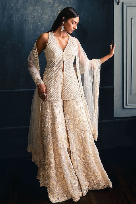 Shop for these amazing collections of Ivory Net Embroidered 3d Floral Motifs V Neck Kurta Sharara Set For Women by Seema Gujral online at Aza Fashions. Floral Sharara, Orang India, Seema Gujral, Sharara Designs, Sangeet Outfit, Crystal Embroidery, Gaun Fashion, Indo Western Dress, Indian Dresses Traditional