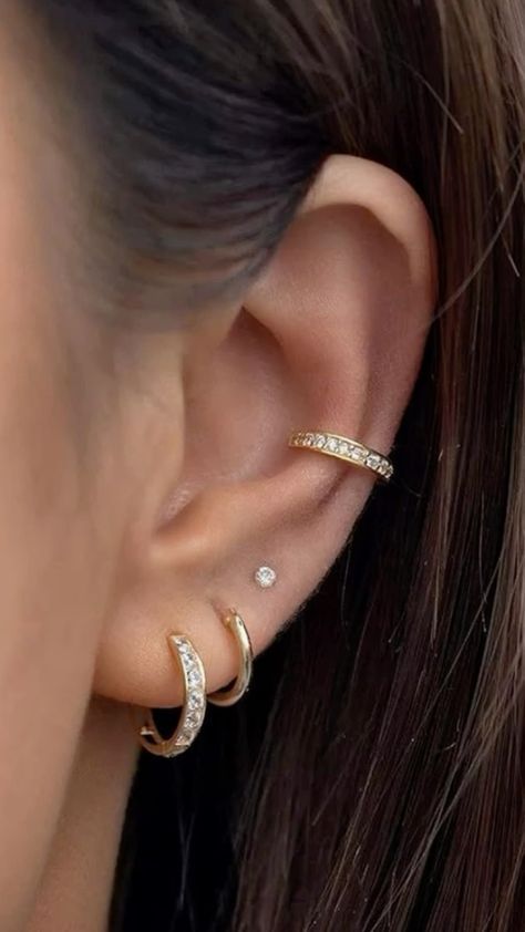 Discover trendy ear piercing ideas that range from classic lobes to edgy helix and daith piercings! Get inspired to mix and match styles for a personalized look. ✨ #EarPiercingIdeas #PiercingInspo #HelixPiercing #LobePiercing #DaithPiercing #PiercingStyle #Piercing #nosepiercing #bellybuttonpiercing #industrialpiercing #lippiercing #tonguepiercing #earpiercing #cartilagepiercing #spiderbitepiercing #multipleearpiercing #facialpiercing #hippiercing #earcuff #earjewelry #eargauge  #goldearrings #earplugs #diamondearrings #pearlearrings #earmuffs #silverearrings #hoopearrings #beadedearrings Trendy Piercings Ear, Women’s Piercings, Trending Ear Piercings, Pretty Ear Piercings Simple, Minimal Ear Piercing Ideas, Ear Piercings For Women Over 50, How To Style Ear Piercings, Triple Earlobe Piercing Ideas, Hot Ear Piercings