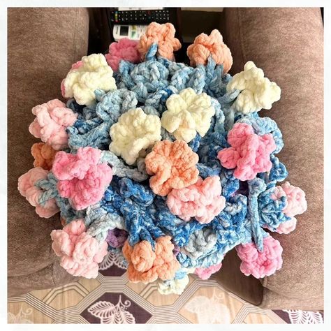 ~Fluffy Bouquet Blanket 💐 ~ All rolled up.. the flowers look soo gorgeous.. the spark of bright colors is so mesmerizing.. ➡️Swipe to see how the blanket is rolled up.. Pattern: Fluffy Bouquet Blanket by @little.artsy.aloe (I made 24 flowers instead of 40) Yarn: Speckled and Blankie by @gangaacrowools #flowerbouquet #blanket #bespokeblanket #bespokemakes Flower Bouquet Crochet Blanket, Puff Flower Blanket, Crochet Bobble Flower Pattern, Flower Bobble Crochet, Cute Flower Crochet Blanket, Bright Colors, Flowers Bouquet, Rolls, Yarn