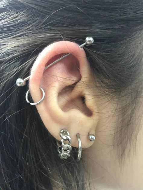 Industrial piercings helix Loads Of Ear Piercings, Under Tongue Piercing, Ear Piercings Helix Hoop, Both Ears Pierced Ideas, Grunge Earrings Piercings, Asian Ear Piercing, Alt Ear Piercings, Alt Piercings Ear, Double Industrial Piercing