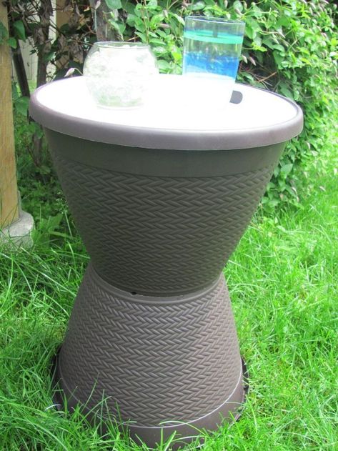 See how to stack Dollar Store pots to make this awesome idea for your yard: You'll be happy you saw this! This is the time of year when we may yearn for new outdoor furniture, a dream that is too often out of reach for the budget-impaired. diy | summer | table | diy table | summer table | diy table | summer | summer table | outdoor table #ad Diy Garden Table, Small Garden Table, End Table Makeover, Dollar Store Ideas, Diy Side Table, Outdoor End Tables, Summer Table, Diy Event, Table Outdoor