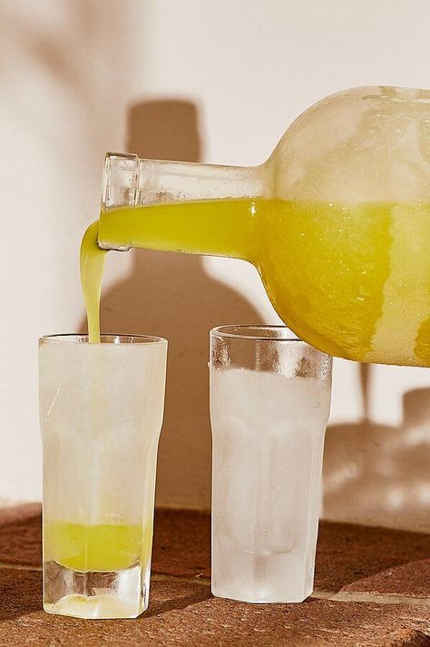 This homemade limoncello boasts rich lemon flavor without being too boozy or sweet. Look for unwaxed organic lemons, or be sure to give the whole citrus a good scrub before peeling. Juice leftover peeled lemons, and freeze juice up to 3 months. #wine #bestwine #pinotnoir #cabsauv #sauvblanc #foodandwine #redwine #whitewine #redblendwines Cocktails With Rum, Simple Cocktails, Vodka Lemon, Lemon Peels, Limoncello Recipe, Frozen Juice, Homemade Limoncello, Body Cleanse Diet, Homemade Liquor