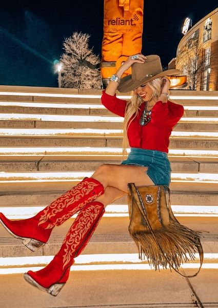 Cowgirl Knee High Boots Outfit, Cute Rock And Roll Outfits, Black Dress Red Cowboy Boots, Western Outfits Black Women Party, New Years Eve Outfits Cowgirl, Rodeo Date Night Outfit, Outfits For Billy Bobs Texas, Rock N Roll Western Style, Leather Fringe Jacket Outfits