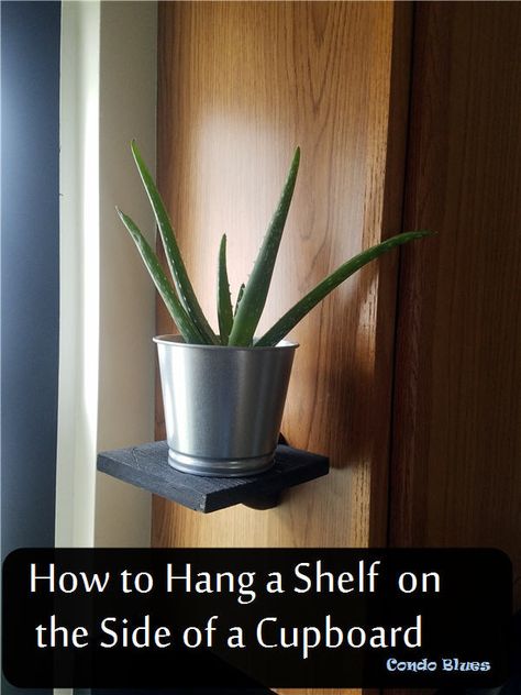 How to hang a shelf on the side of a kitchen cupboard or cabinet. A cool wine cork hack! #kitchenideas #hacks #winecork #ideas #decor #kitchen Kitchen Shelves For Plants, Plants On Side Of Kitchen Cabinet, Small Shelves On Side Of Kitchen Cabinet, Side Shelves On Kitchen Cabinets, Cabinet Side Shelves, Side Of Kitchen Cabinet Decor, Shelves On Side Of Cabinet, Shelf On Side Of Kitchen Cabinet, Side Of Cabinet Shelves