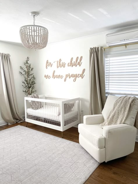 Neutral Nursery for boy or girl #genderneutralnursery #nurserydecor #nursery #nurseryideas #babyboy #babygirl #homedecorideas #homedecoration Nursery With Tan Walls, Pottery Barn Nursing Chair, Neutral Calm Nursery, Newborn Nursery Ideas Neutral, Off White Nursery Walls, Neutral Nursery For Girl, Plain Nursery Ideas, Nursery Room Idea, Clean Nursery Ideas