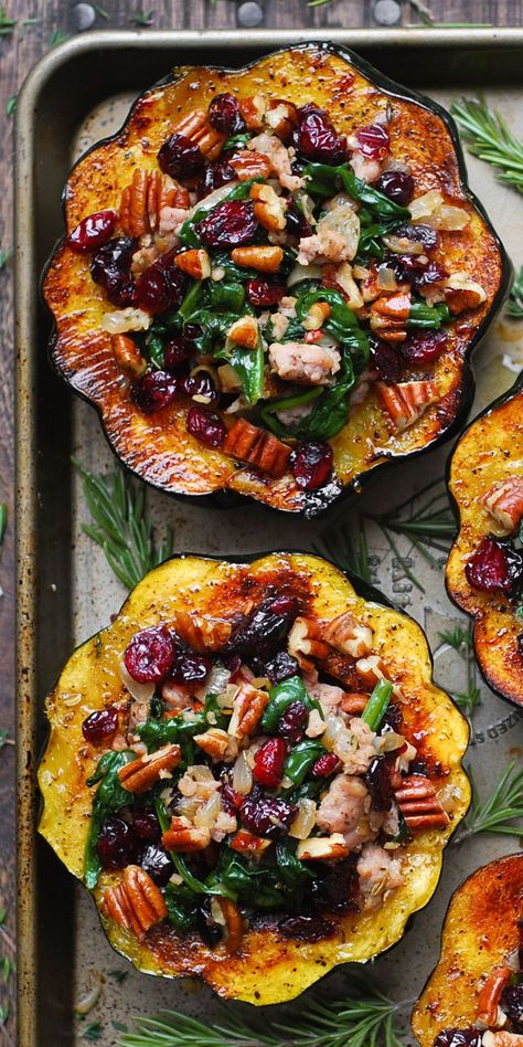 Stuffed Acorn Squash with Sausage, Spinach, Dried Cranberries, and Pecans on a baking sheet Acorn Squash With Sausage, Acorn Squash Recipes Healthy, Squash With Sausage, Sausage Stuffed Acorn Squash, Sausage Spinach, Stuffed Acorn Squash, Acorn Squash Recipes, Acorn Squash, Think Food