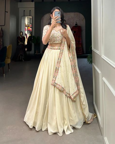 "Make a mesmerizing statement in our off-white lehenga choli! 🌷✨ Exquisite embroidery, shimmering sequins, and unparalleled elegance. Capture hearts and steal the spotlight effortlessly! #weareffortlessly #LehengaCholiLove #OffWhiteElegance #EmbroideredPerfection #SequinSparkle #FestiveFashion #EthnicChic #WeddingWear #LehengaGoals" ▪️Lehenga(Stitched) Lehenga Fabric : Georgette Lehenga work : Sequins and Thread Embroidery Work With Lace Border Lehenga Waist : SUPPORTED UP TO 42 Lehenga Cl... Wedding Chaniya Choli, Lehenga Sari, Zip Stitching, White Lehenga Choli, Lehenga Choli Designs, Stylish Kurtis Design, Lehenga Saree Design, White Lehenga, Simple Lehenga