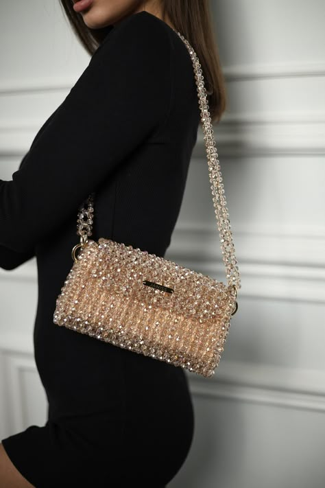 Crystal beaded bags are popular choices for formal occasions, evening events, or any time when a touch of glamour is desired. They can add a statement-making element to an outfit and are often chosen to complement elegant dresses or evening gowns. The beaded texture of the bag not only adds visual interest but also provides a tactile and luxurious feel. Whether you're treating yourself or searching for the perfect gift for a fashion-forward friend, this crystal beaded bag is sure to impress. Ele Sparkle Purse, Charm Bracelets For Girls, Glitter Outfit, Gold Handbag, Hand Beaded Bag, Crystal Handbag, Beaded Clutch Bag, Glitter Bag, Diy Leather Bag