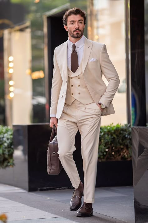 Command attention with the Beige Slim-Fit 3-Piece Suit from VIOSSI. The single-breasted blazer, boasting peak lapels and a refined 2-button closure, adds a modern flair. Pair it meticulously with the coordinating waistcoat and trousers for a distinguished, versatile ensemble. #slimfitsuit #beigesuit #peaklapels #mensfashion #elegantstyle #tailoredensemble #suitup #moderngentleman #formalwear #sophisticatedlook Beige Wedding Suit, 3 Piece Suit Men Wedding, Beige Suits For Men, 3 Piece Suit Men, Cocktail Attire Men, Beige Suit, Suits Groom, Cream Suit, Suit Stores