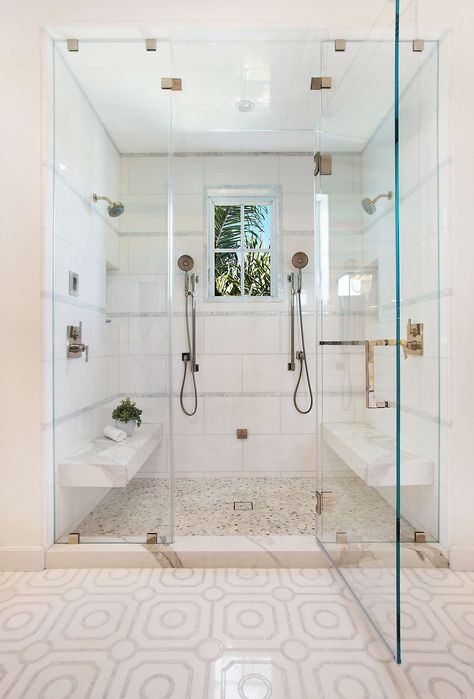 An all white shower with glass doors with multiple shower heads. Our bathrooms at home see a lot of action, and when it is a shared bathroom, the activity doubles. From master baths to Jack and Jill baths, consideration needs to be taken on how the room will function for those using it, regardless if one person is using the space, or if the room is truly shared at the same time... Read more on the Dura Supreme Blog! Master Shower 2 Shower Heads, Showers For 2 People, Large Shower With Two Shower Heads, Shower For Two Walk In, Double Shower Head Bathroom, Two Headed Shower Ideas, Shower With Two Heads Master Bath, Two Person Shower Walk In, 2 Person Shower Master Bath