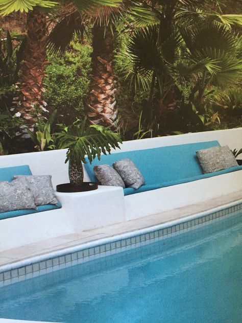 Laid back seating area with built in side table Built In Seating Around Pool, Pool Seating Ideas Built Ins, Built In Pool Seating, Pool Side Seating Ideas, Pool Built In Seating, Pool Bench Seating, Built In Side Table, Pool Seating, Outside Benches