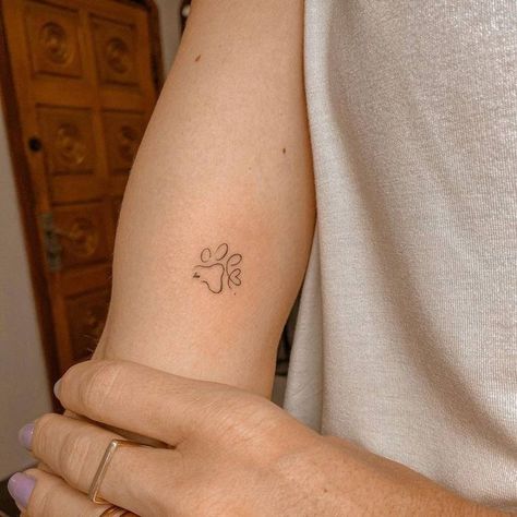 Outline Paw Tattoo, Cute Dog Tattoos Simple, Dog Arm Tattoos For Women, Simple Paw Print Tattoo Outline, Dainty Dog Paw Tattoo, Delicate Dog Paw Tattoo, Dog Paw Minimalist Tattoo, Tiny Dog Paw Print Tattoo, Dog Paw Fine Line Tattoo